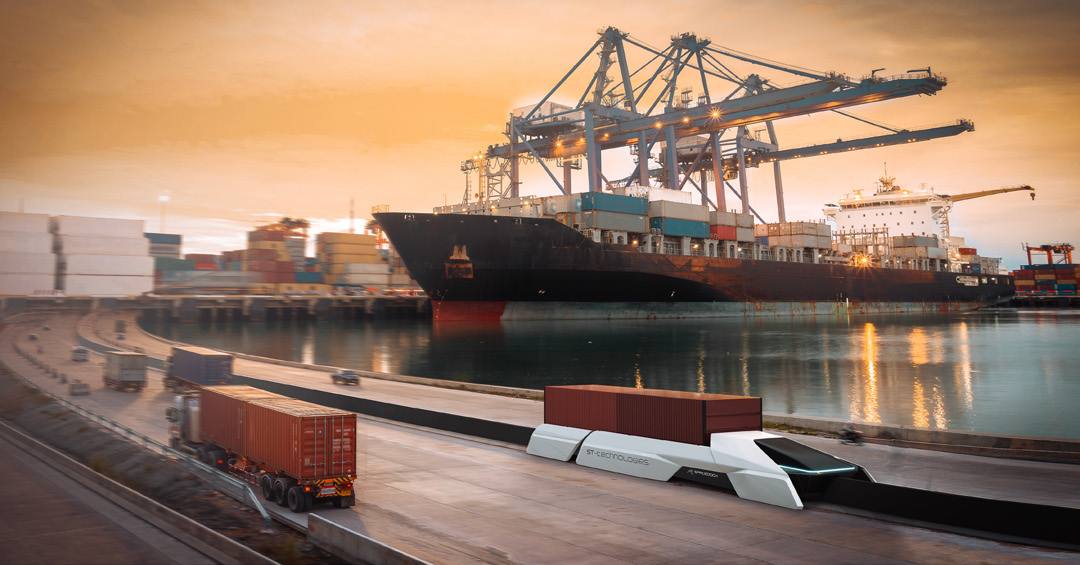 Aerodock shuttle on a quay beside a container ship
